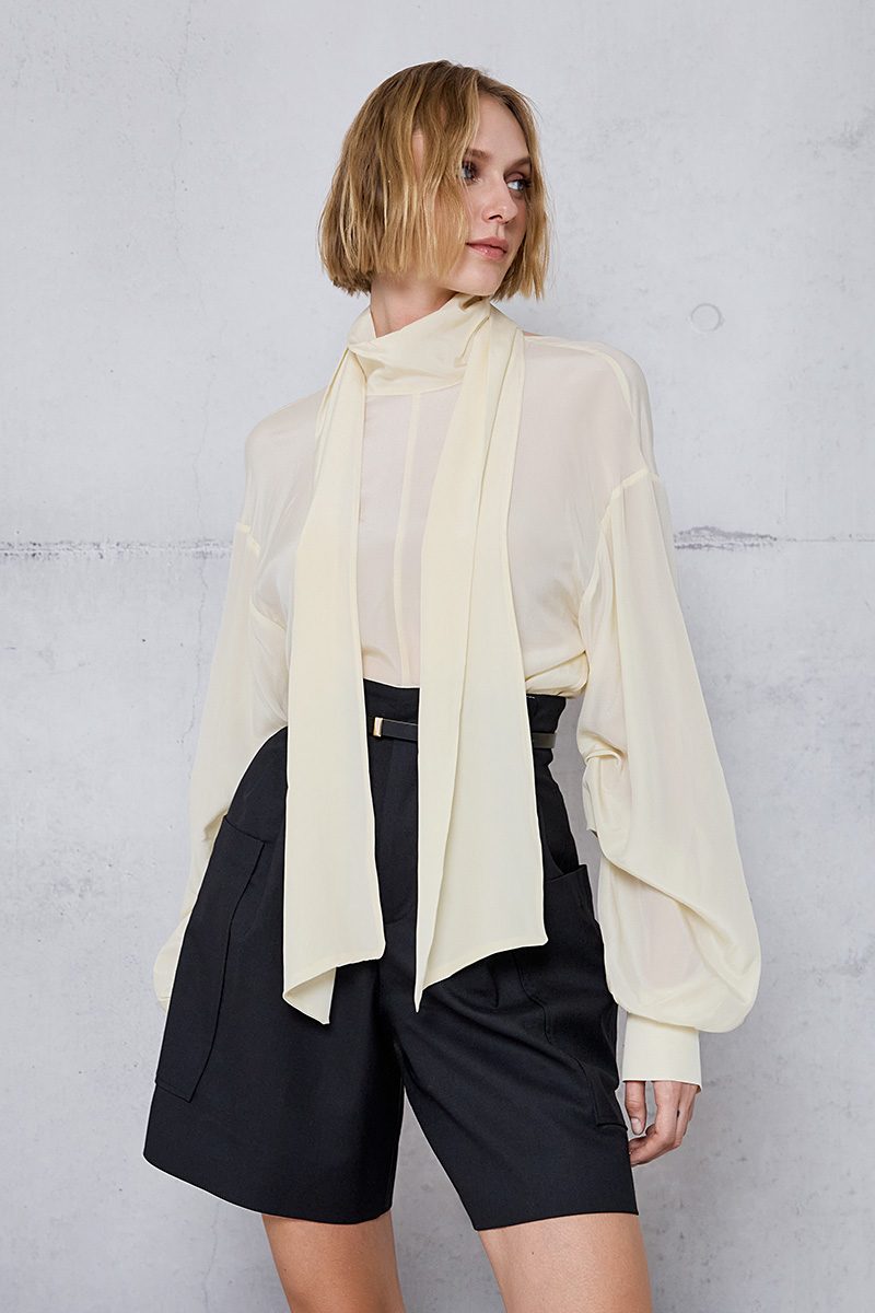 BLOUSE WITH A TIE AND BACK CUTOUT